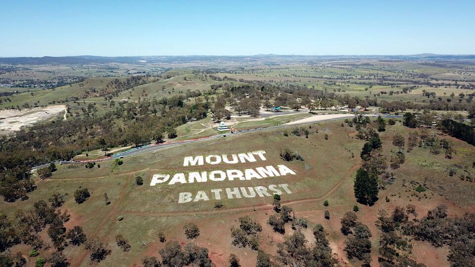 A landscape with 'MOUNT PANORAMA BATHURST' written on the ground.