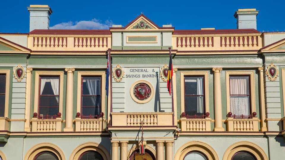 A building with ornate architectural details, including a sign that reads "General & Savings Banking."