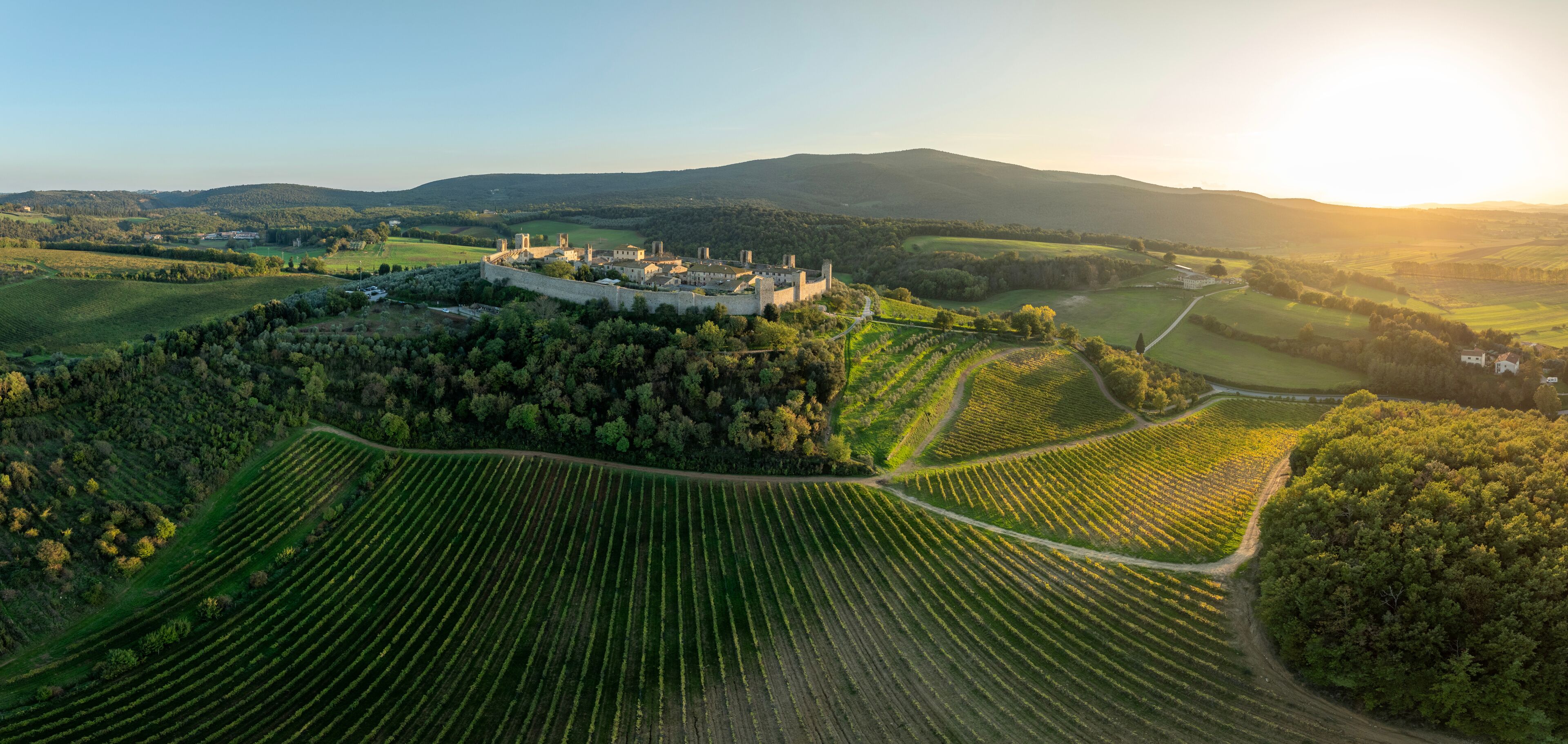 Beautiful autumn countryside with old town Monteriggioni, Tuscany, Italy