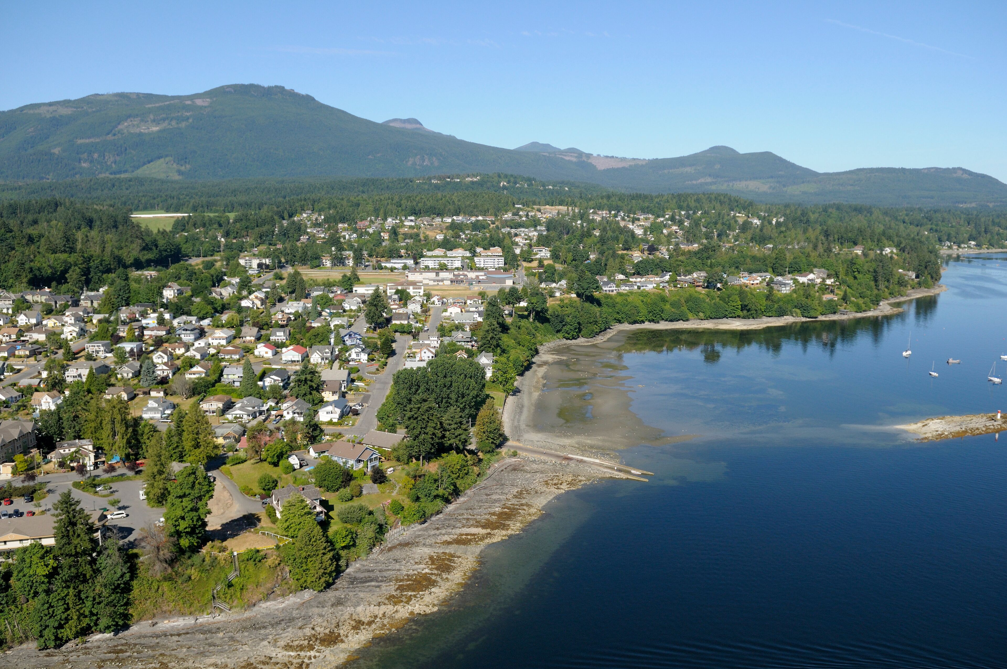 Aerial photo of Kinsmen Beach Park and the boat launch at the end of Maple Street in Chemainus, Vancouver Island, British Columbia, Canada.