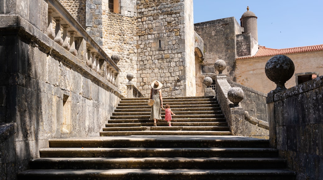 Traveling mom and little girl visiting a castle
