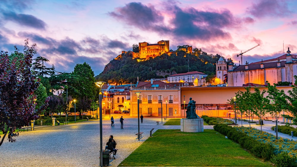Sunset view of Leiria castle overlooking the old town, Portugal