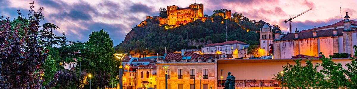 Sunset view of Leiria castle overlooking the old town, Portugal