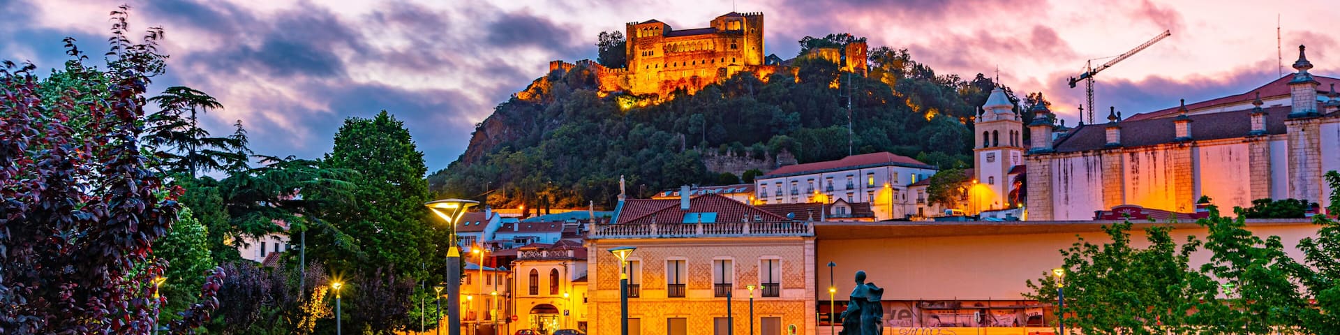 Sunset view of Leiria castle overlooking the old town, Portugal