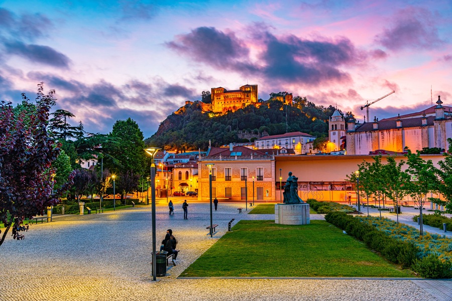 Sunset view of Leiria castle overlooking the old town, Portugal