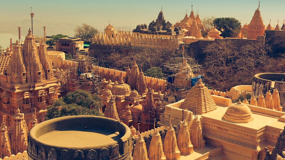 A detailed view of a temple complex with multiple spires and intricate architecture.