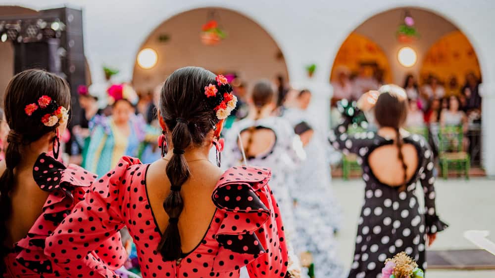 spanish woman dressed as sevillanas at a traditional festival in Rota, Spain