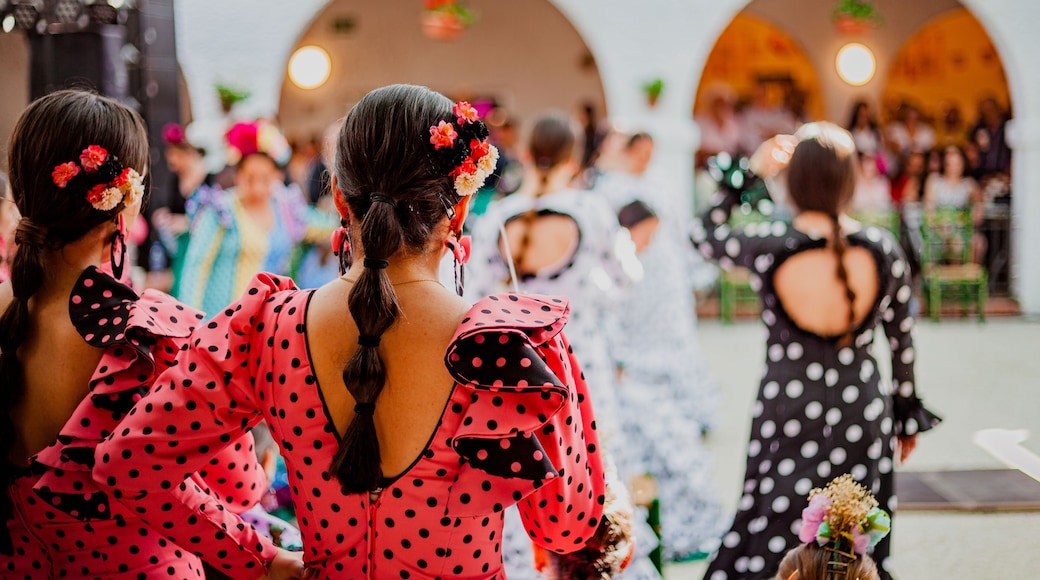 spanish woman dressed as sevillanas at a traditional festival in Rota, Spain