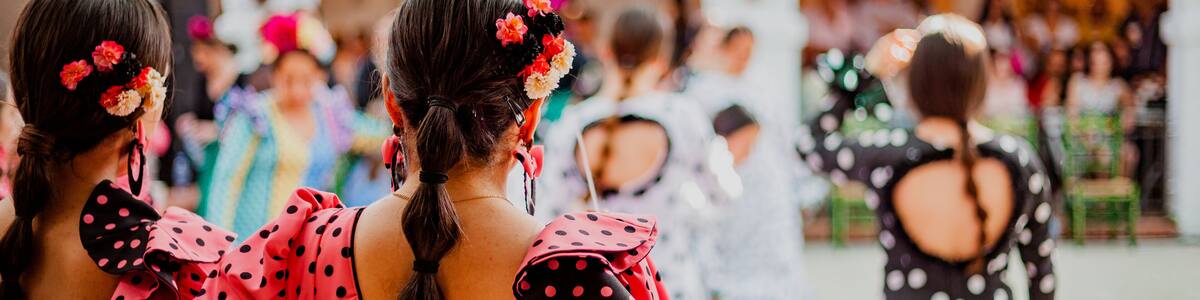 spanish woman dressed as sevillanas at a traditional festival in Rota, Spain