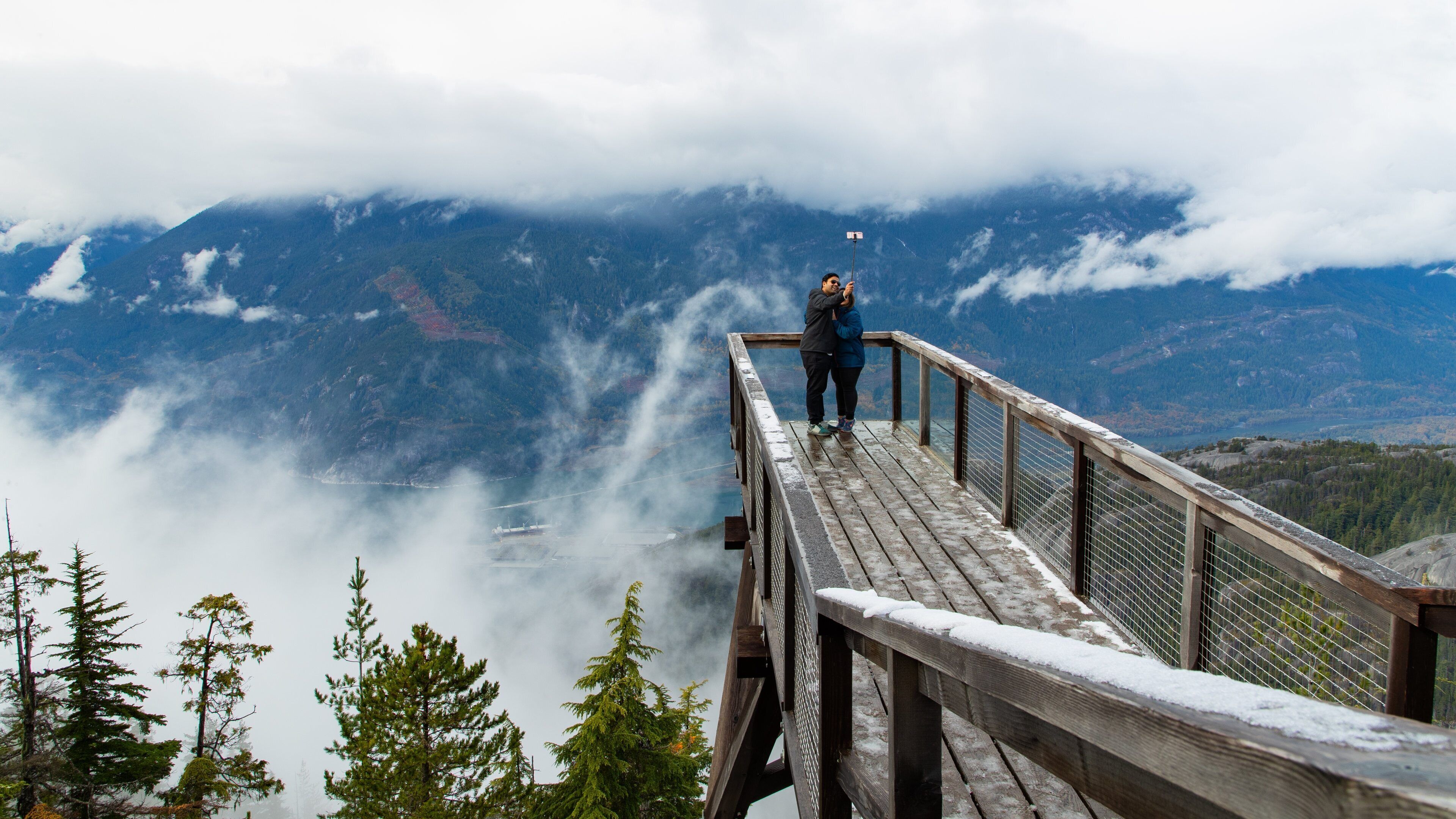 Squamish showing mist or fog and views as well as a couple