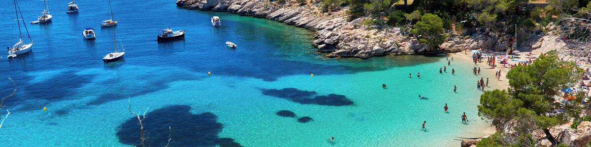 People enjoying vacations in the Cala Salada lagoon. Idyllic scenery. Ibiza, Balearic Islands. Spain