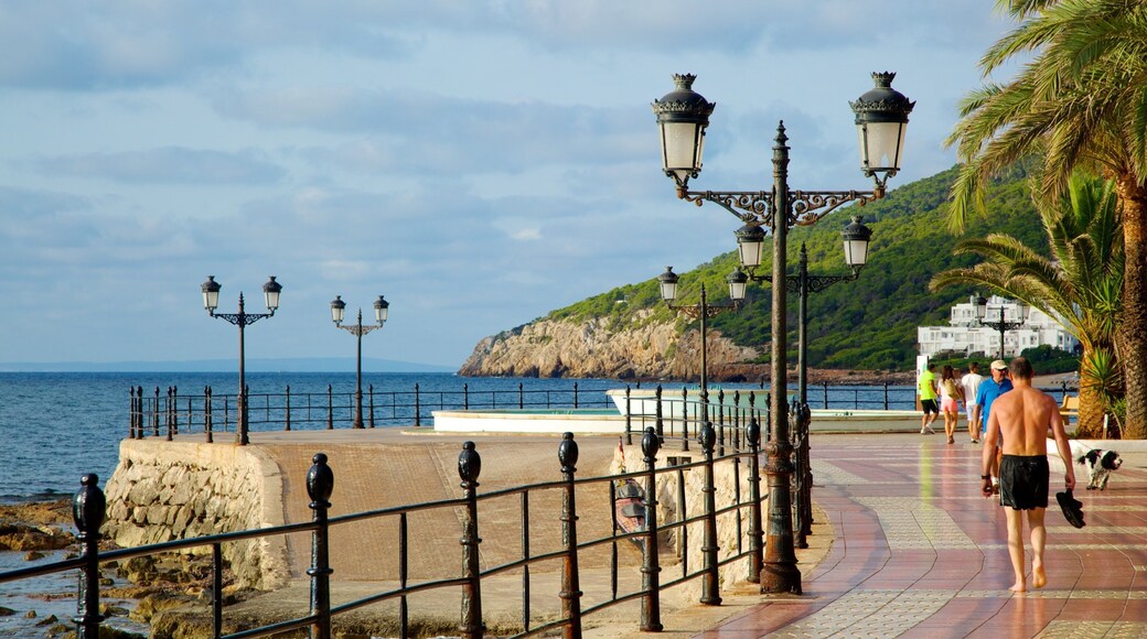 Santa Eulalia del Rio which includes general coastal views and a coastal town as well as an individual male