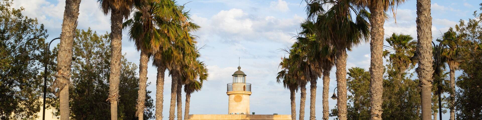 Roquetas de Mar which includes a lighthouse and a coastal town