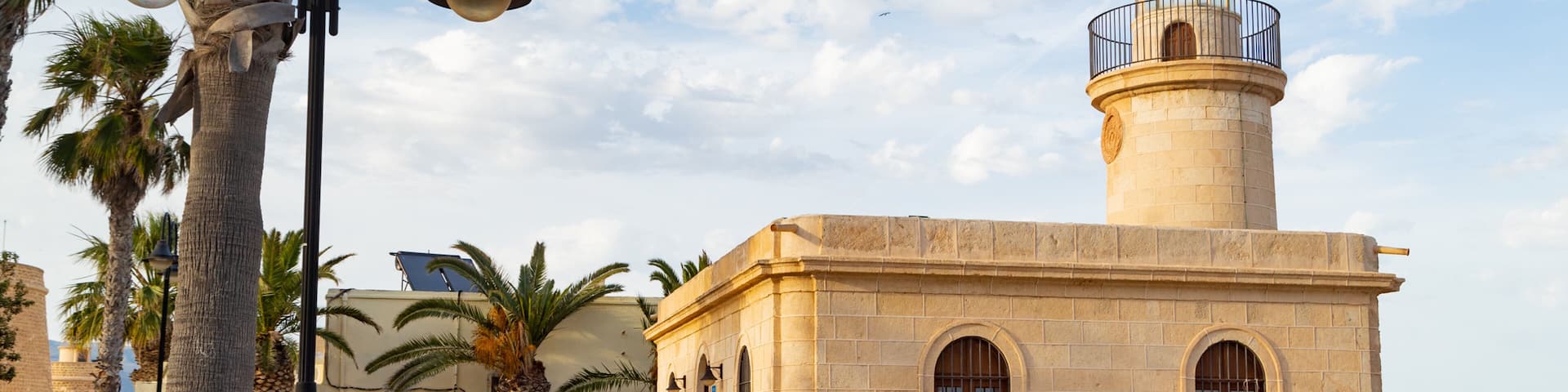 Roquetas de Mar which includes a lighthouse and a coastal town