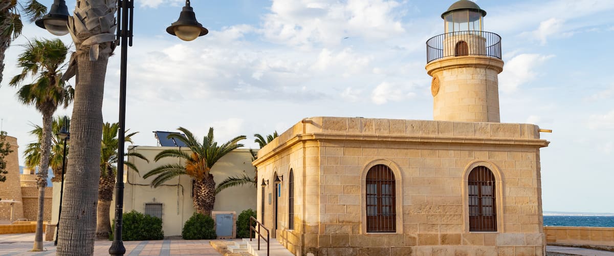 Roquetas de Mar which includes a lighthouse and a coastal town