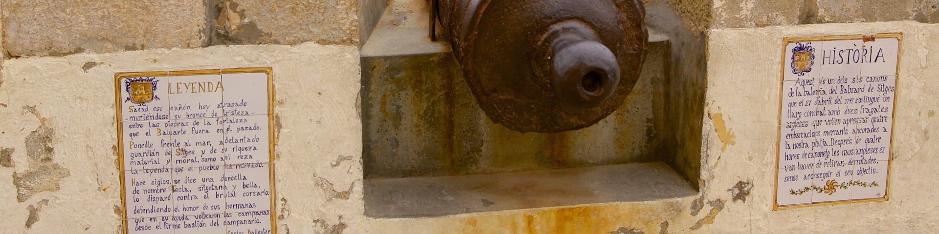 Sitges which includes military items and general coastal views