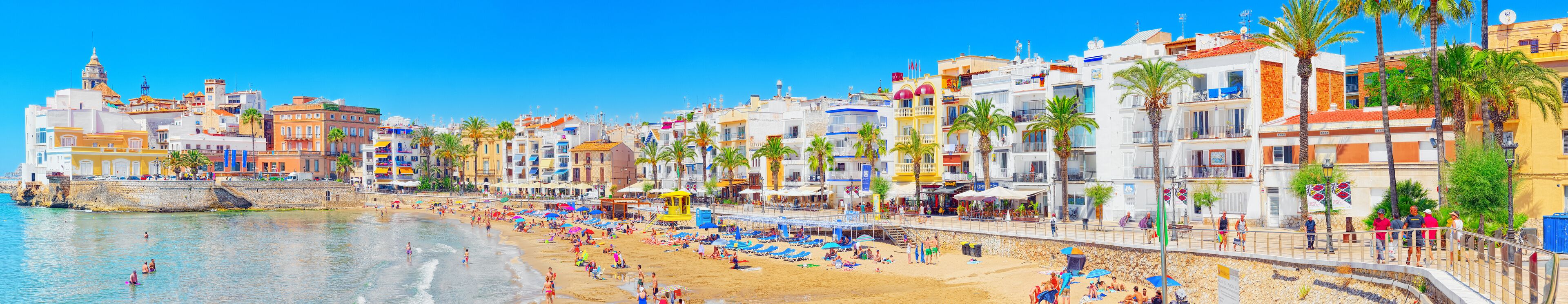 View of the beach and the sea shore of a small resort town Sitge