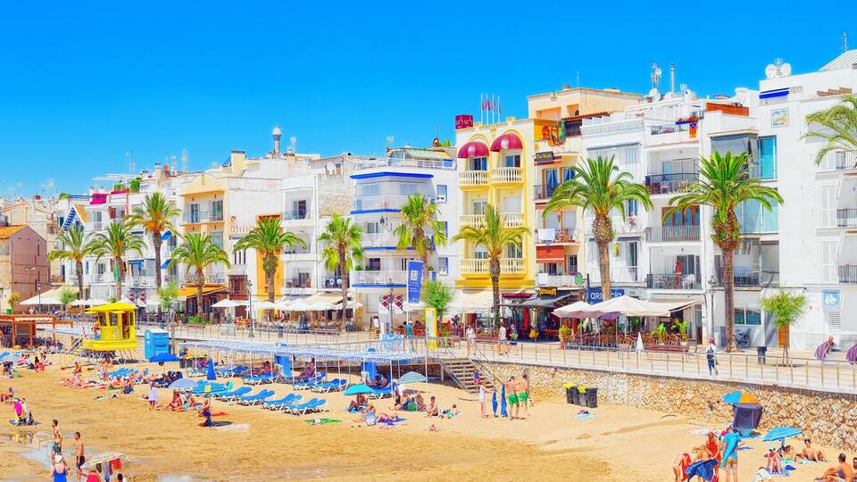 View of the beach and the sea shore of a small resort town Sitge