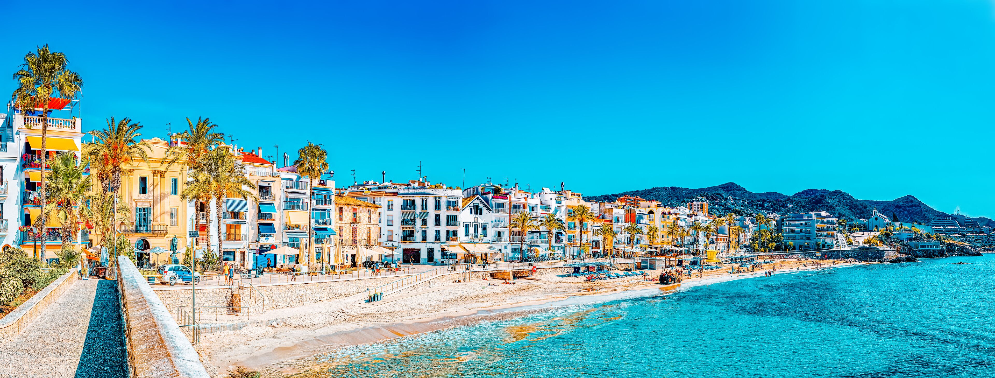 View of the beach and the sea shore of a small resort town Sitge
