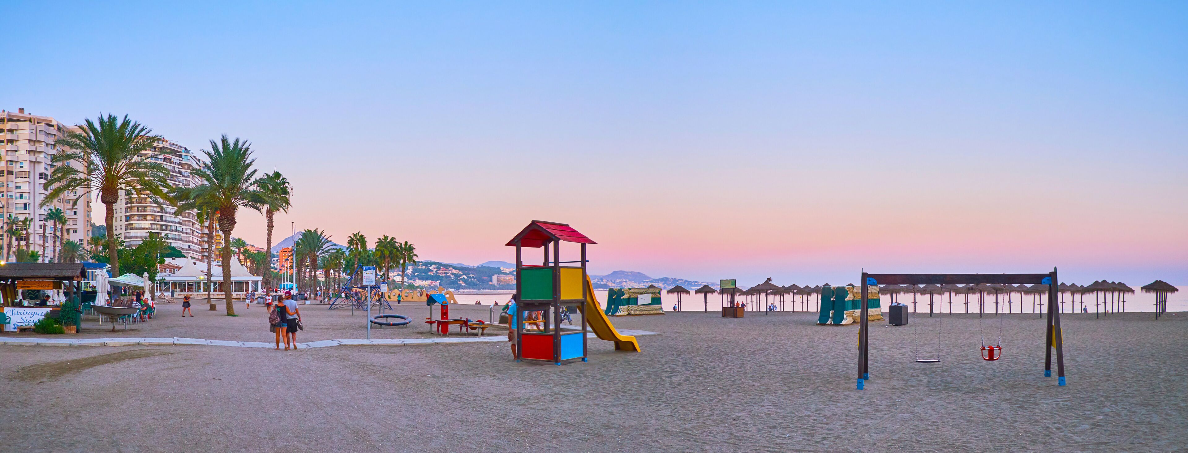 Panorama of Malagueta beach with playground, Malaga, Spain