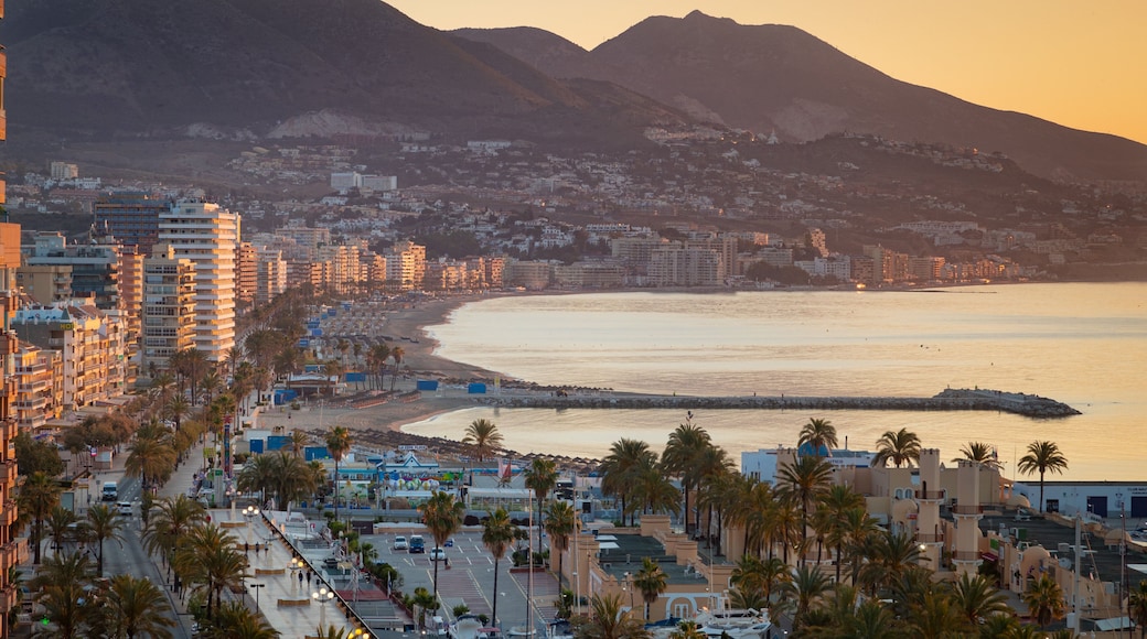 Fuengirola which includes a sunset, a coastal town and landscape views