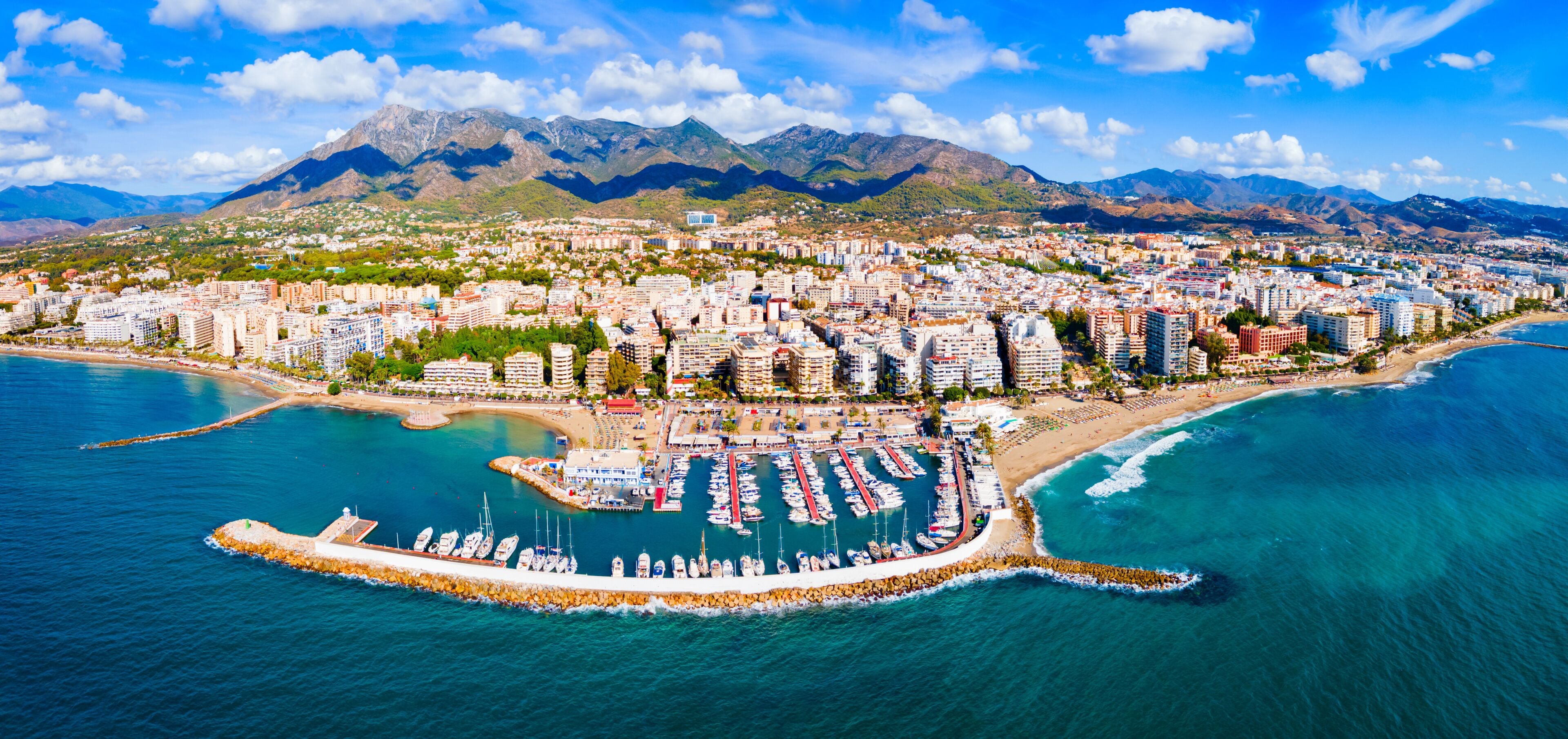 Marbella city port and beach aerial panoramic view