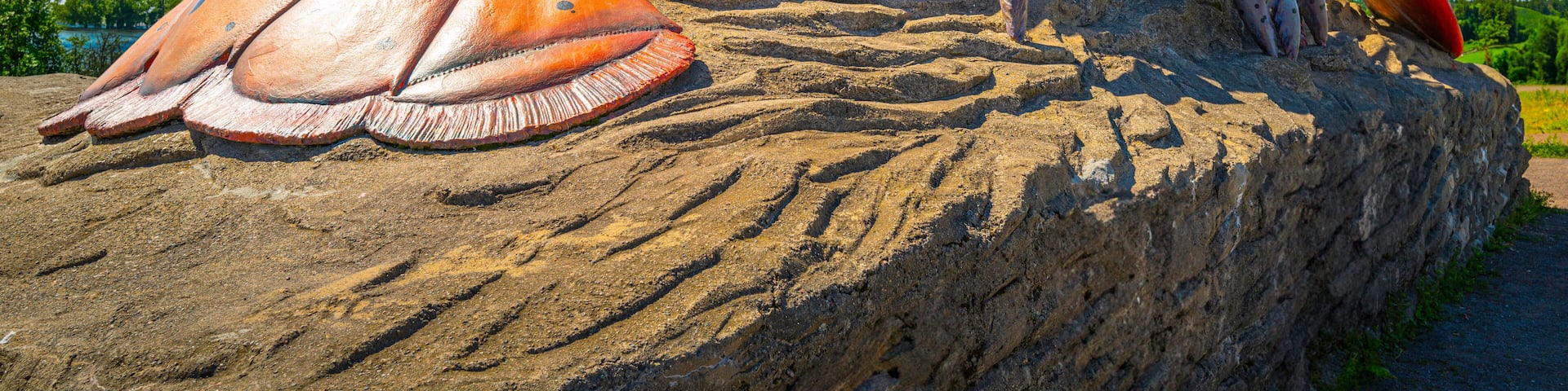 Artificial lobster on the rock in the beach