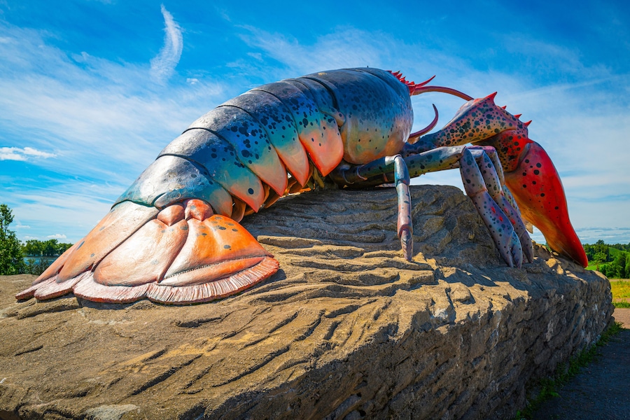 Artificial lobster on the rock in the beach