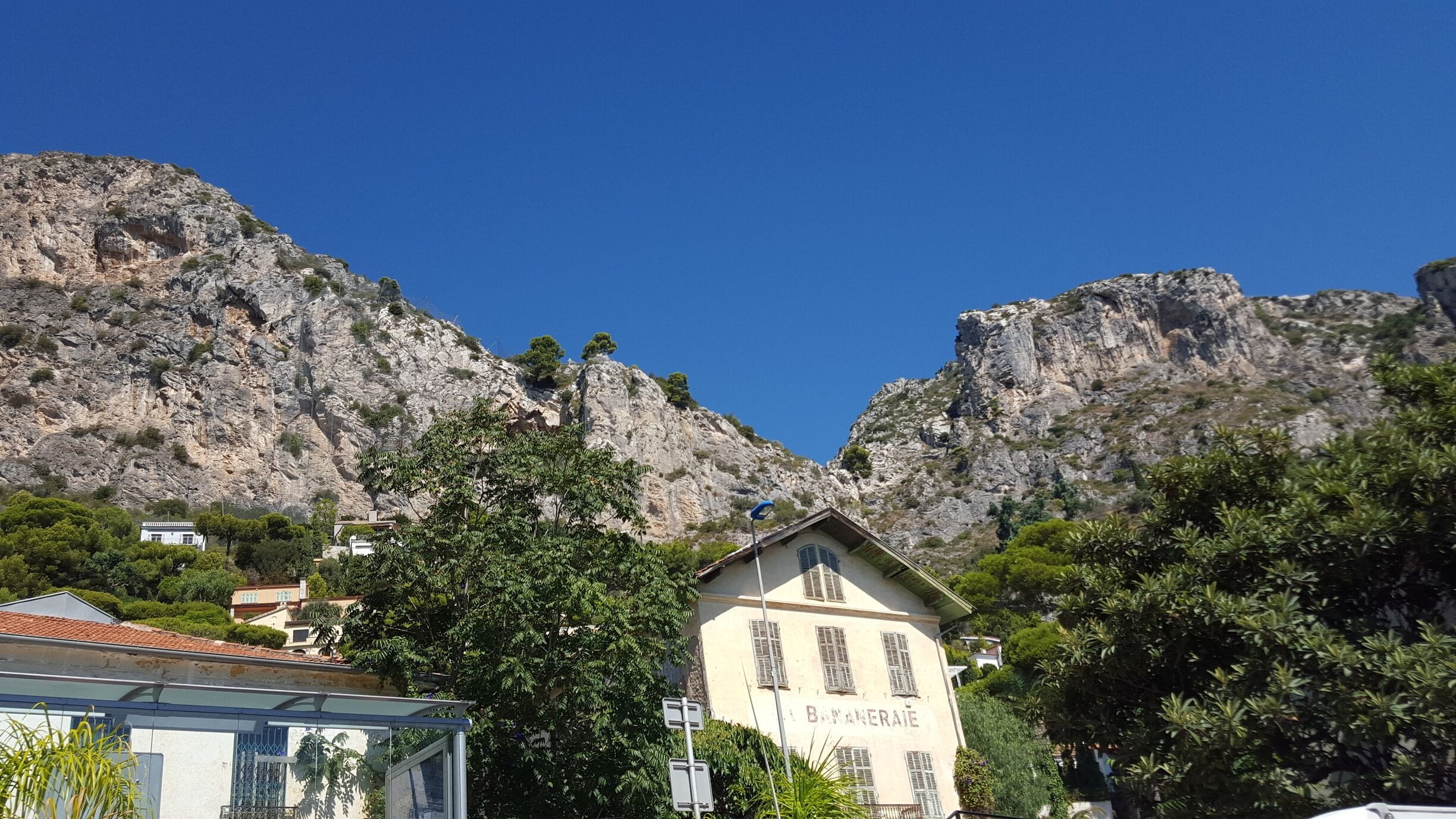 Fourth stop from Nice on your way to Monaco/Monte Carlo.  Eze Le Village is atop the mountain - a good 1 to 2 hrs walk.  Bus # 82 takes you from the station to the village but DO find out times.  We were told that Bus # 100 that can take you via this place between Nice to Monaco or v.v.