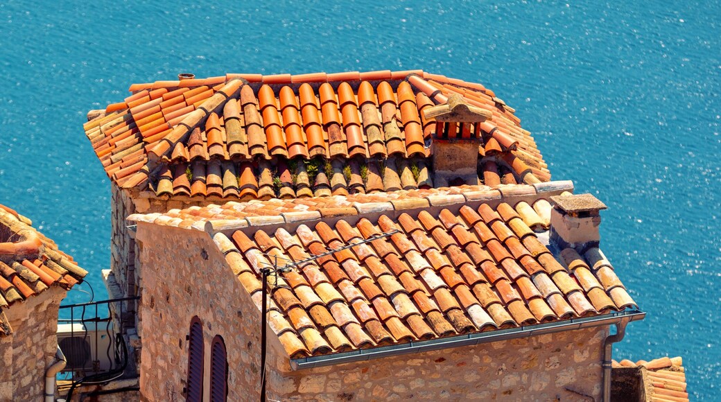 Medieval village Èze in France. Old houses with tiled roofs against the backdrop of the sea. Horizontal banner