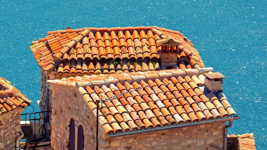 Medieval village Èze in France. Old houses with tiled roofs against the backdrop of the sea. Horizontal banner