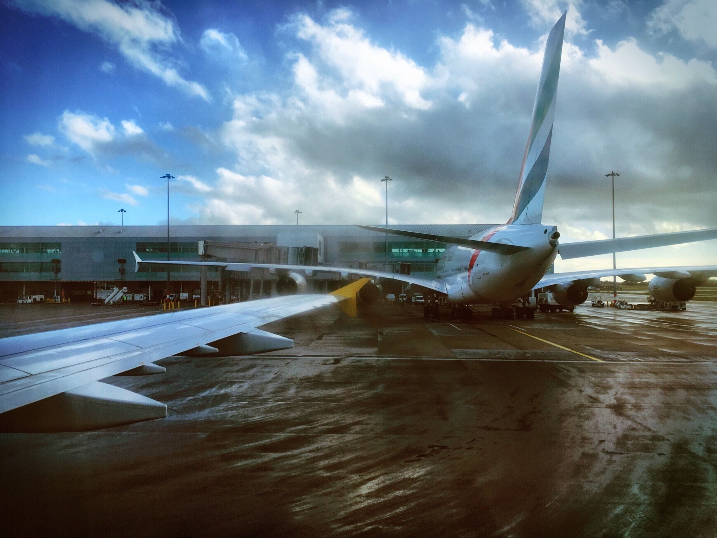 Our little plane taxiing past the massive Airbus A380. Check out that wingspan, it even makes the terminal building look small.
