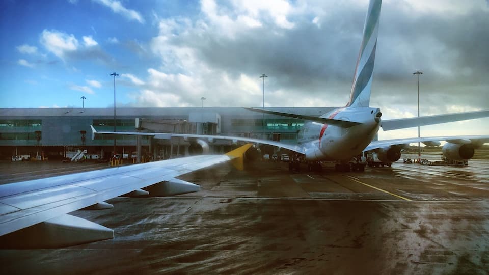 Our little plane taxiing past the massive Airbus A380. Check out that wingspan, it even makes the terminal building look small.