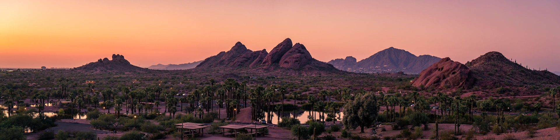 The sunsets over Papago Park in Phoenix, Arizona with Camelback Mountain in the background.