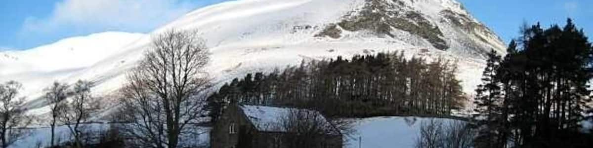 Spittal of Glenshee kirk and Ben Gulabin Although the day was bright and sunny the sun's rays did not reach into the glen. Ben Gulabin by contrast is gleaming with reflected light.