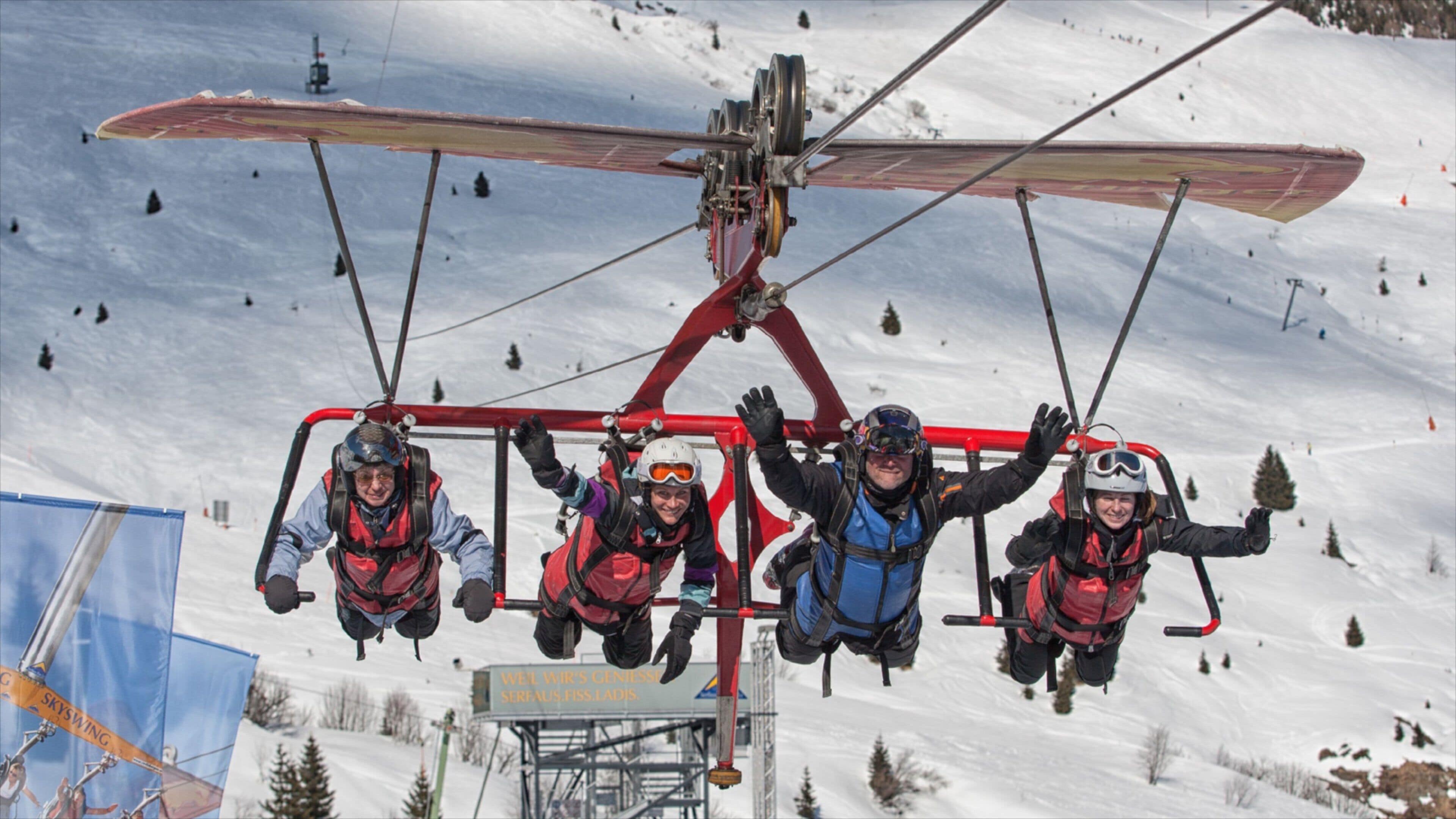 A ski lift with four passengers.