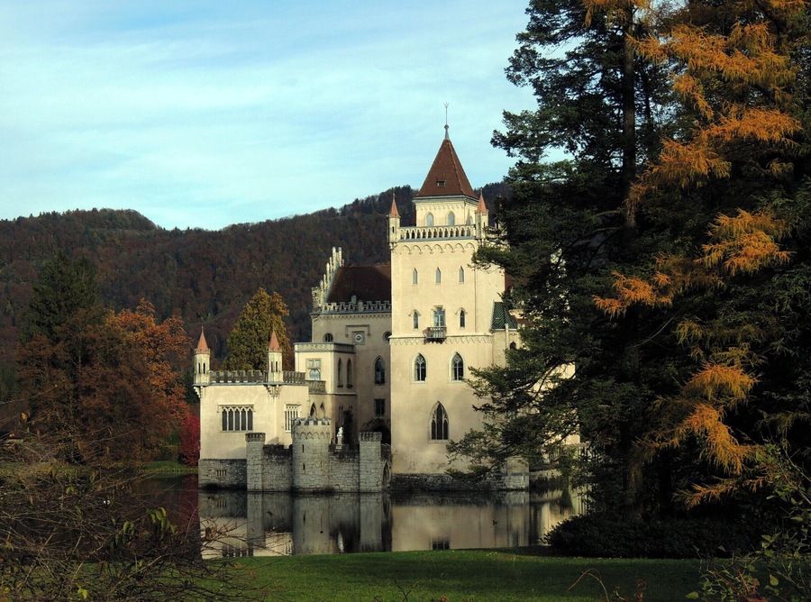 Anif Castle, located at the southern city limits of Salzburg, Austria, looks the quintessential romantic fairy tale.  The castle gained notoriety in films like The Sound of Music, The Great Race, The Odessa Files and The Slipper and the Rose.  
Erected in the early 16th century, the castle was rebuilt by Prince-Archbishop Johann Ernst von Thun about 1693 and served as the summer residence of the Bishops of Chiemsee.  Redesigned in the mid-19th century in the current neo-Gothic style, Anif Castle was the refuge of the deposed king Ludwig III of Bavaria during the German revolution of 1918-19.  
Today the castle is privately owned by the family von Moy.