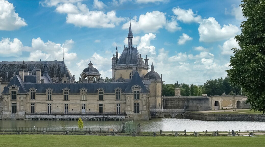 Chantilly castle, in France, beautiful palace with a lake