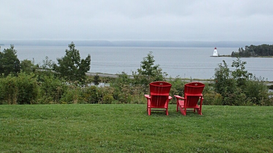 Road trip around Nova Scotia and stop at all the places with #red chairs and enjoy the amazing scenery, you can hike, birdwatching, whale watching or just relax #Red Photo Sweepstakes