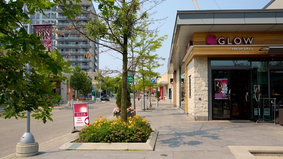 A city street with a restaurant named 'Glow' and a sign for 'Don Mills'.