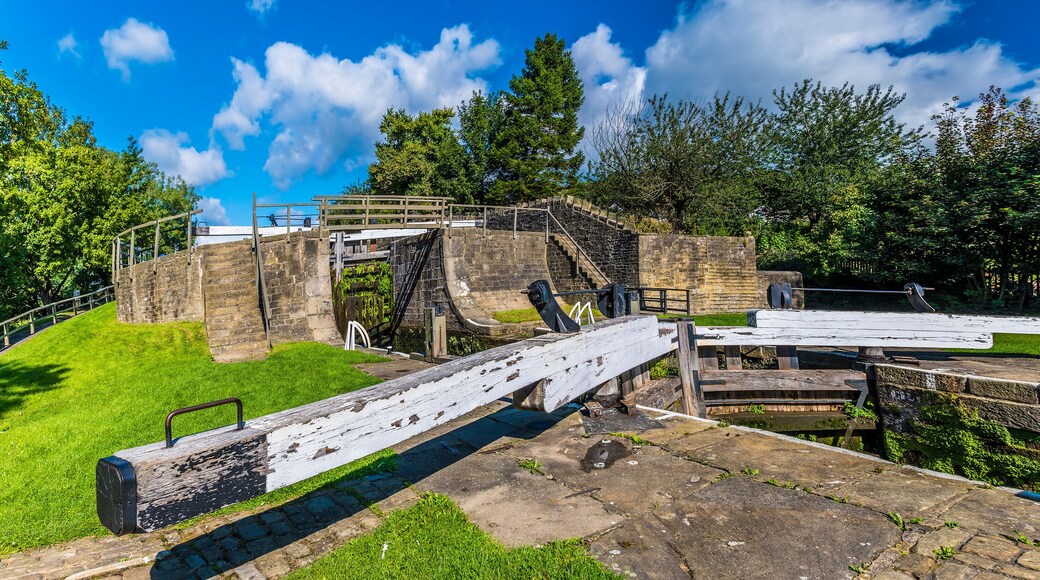 A panorama view across lock gates on the Five Locks network on the Leeds, Liverpool canal at Bingley, Yorkshire, UK in summertime