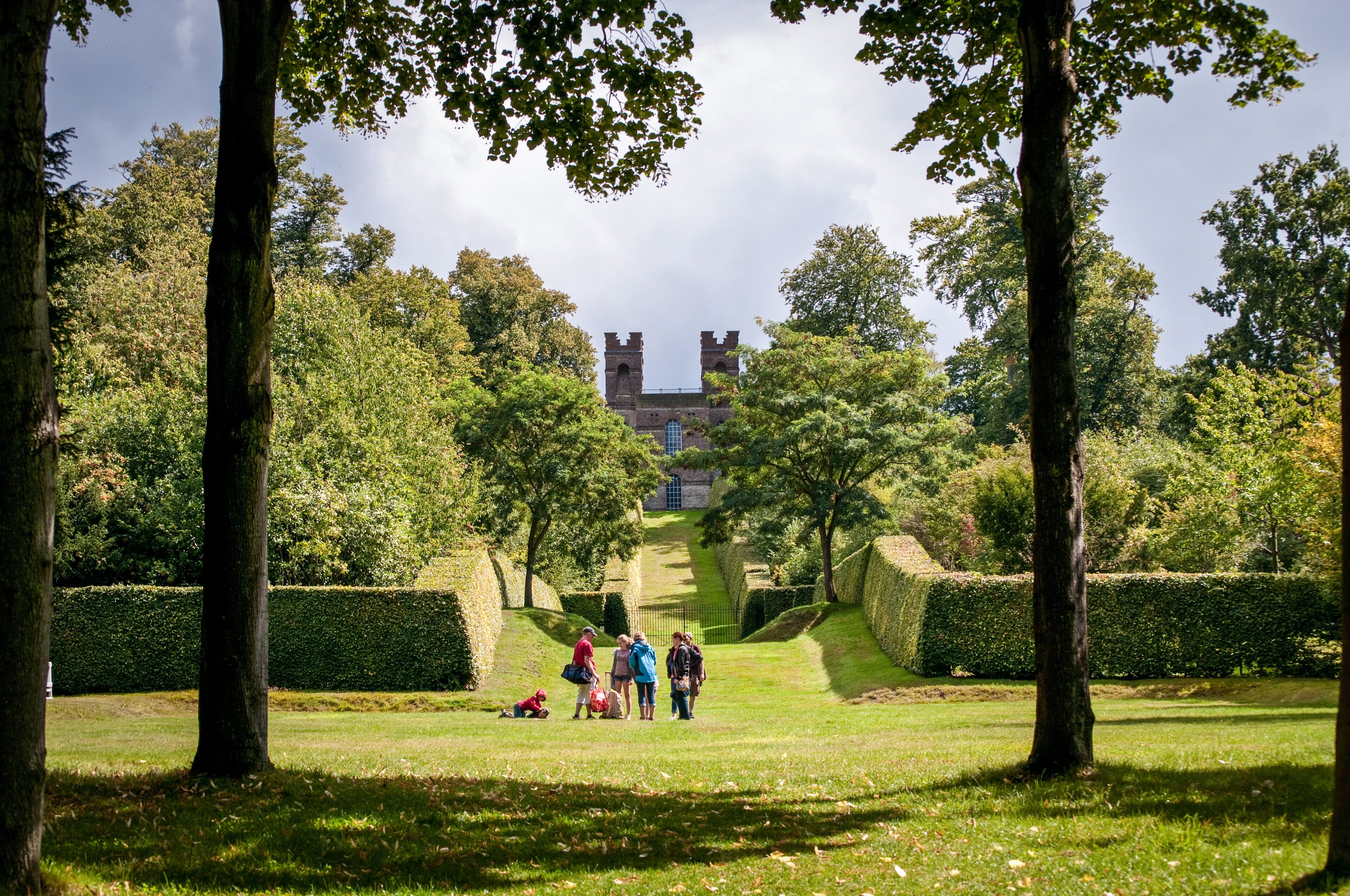 Landscaped vista with Belvedere Tower, at the end of it, Claremont Landscape Garden, Esher, Surrey, UK