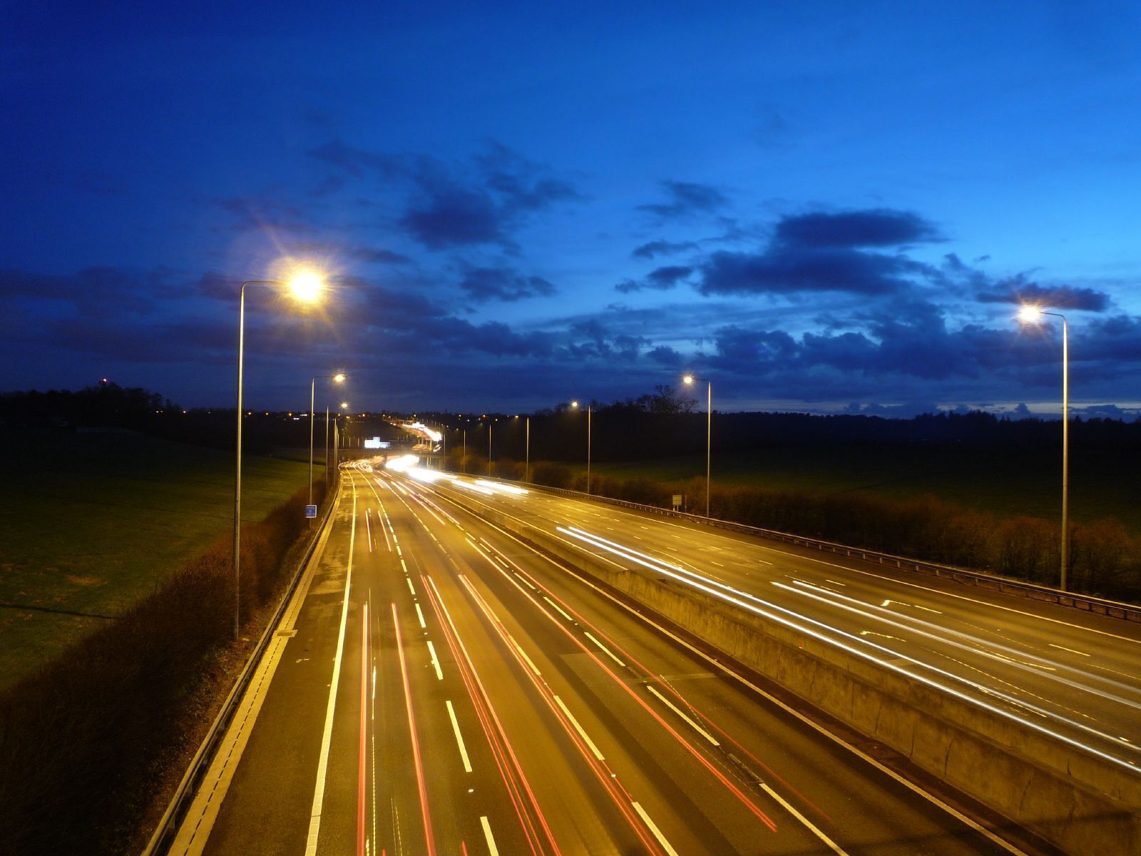 The newly widened M25 motorway at night near Gerrards Cross, Bucks, UK