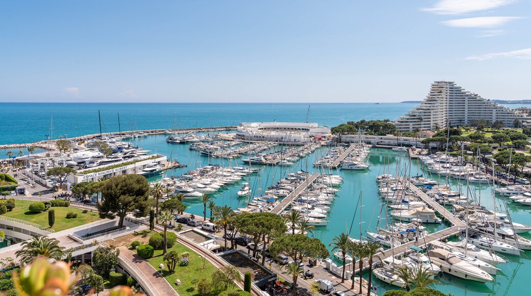 Aerial view of Marina Baie des Anges in Villeneuve-Loubet – luxury yachts, turquoise water, iconic pyramid buildings and Mediterranean Sea on the French Riviera