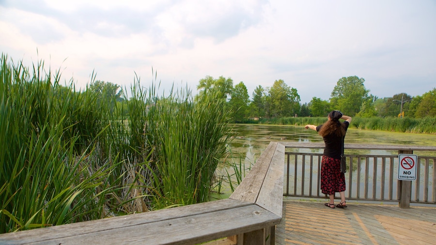 Thornhill featuring a garden and a pond as well as an individual female