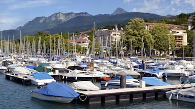 Port of Evian-les-Bains on the banks of Léman lake to the east of France, commune in the Haute-Savoie department in the Rhône-Alpes region, mountains in the background; Shutterstock ID 91867430