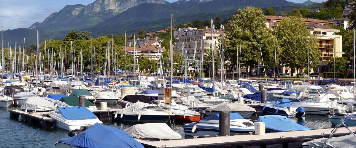 Port of Evian-les-Bains on the banks of Léman lake to the east of France, commune in the Haute-Savoie department in the Rhône-Alpes region, mountains in the background; Shutterstock ID 91867430