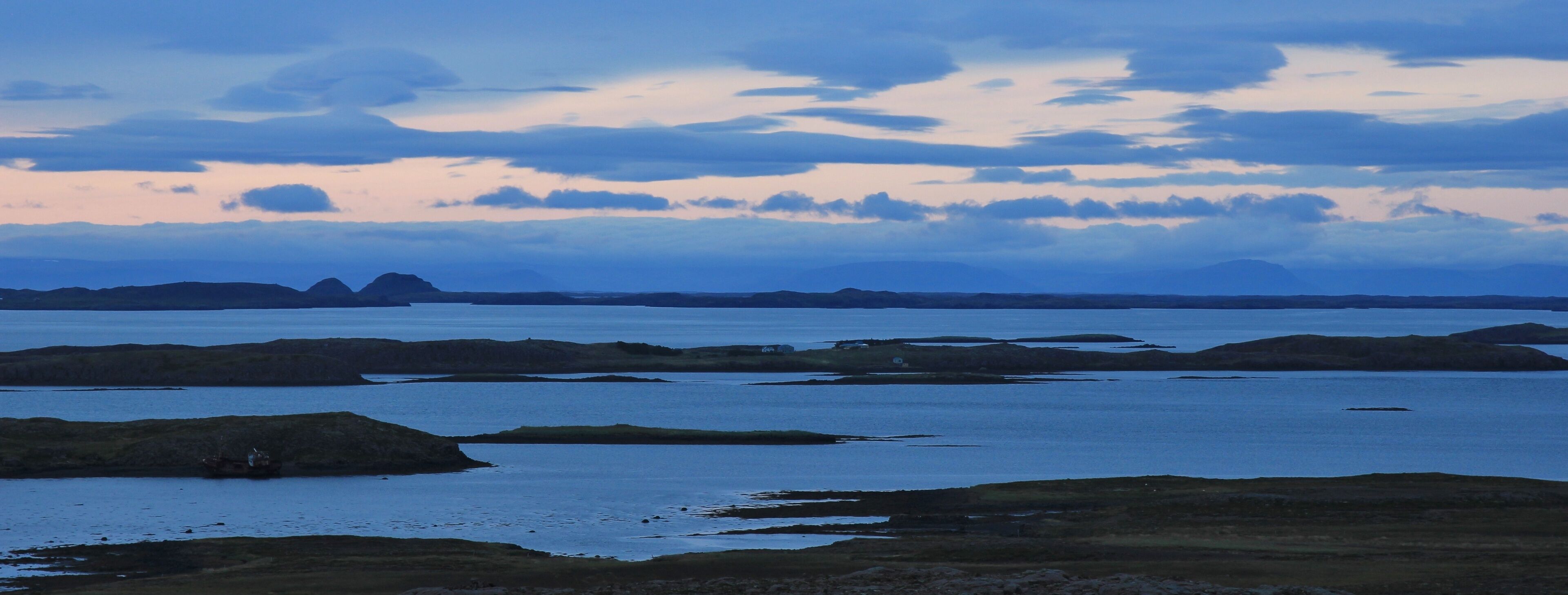 Scene in the westfjords of Iceland. Cloudy summer day. Sunset scene near Budardalur.