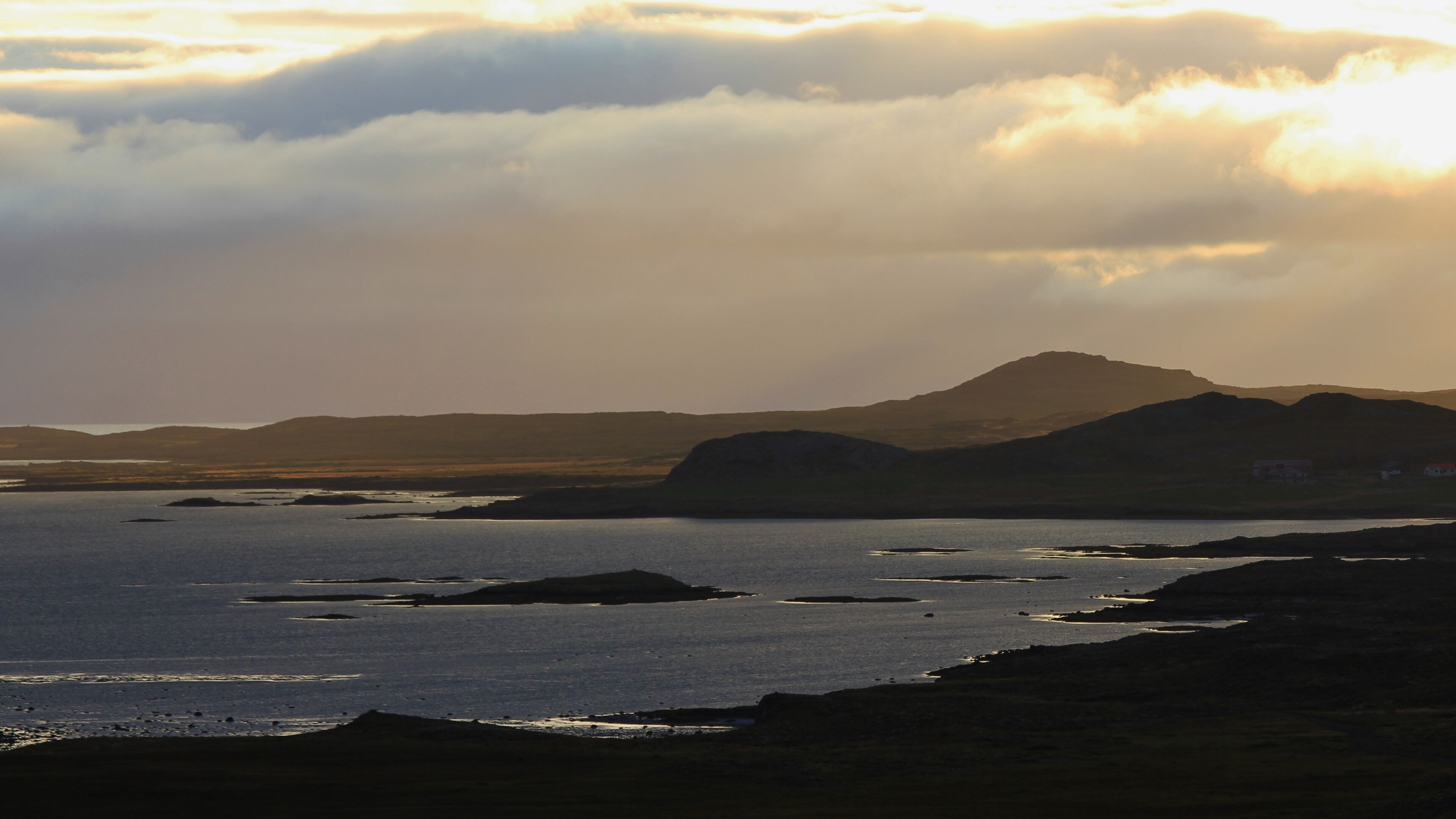 Sunrise in the westfjords of Iceland. Cloudy summer morning. Scene near Budardalur.