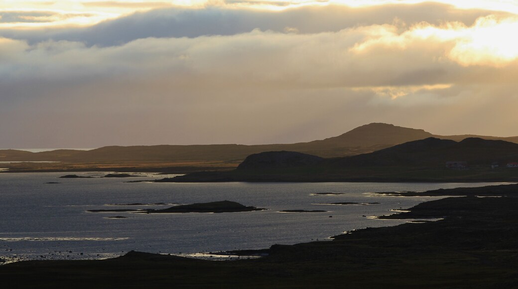 Sunrise in the westfjords of Iceland. Cloudy summer morning. Scene near Budardalur.